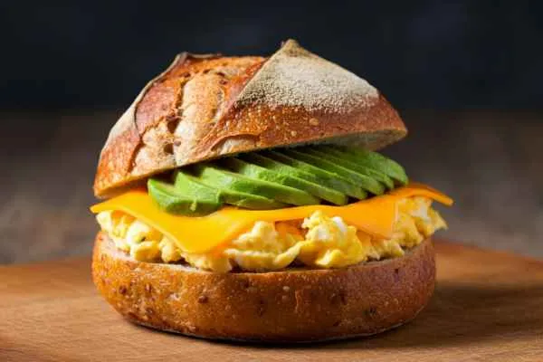 2 Eggs on a Roll with Cheese, Avocado, and Meat