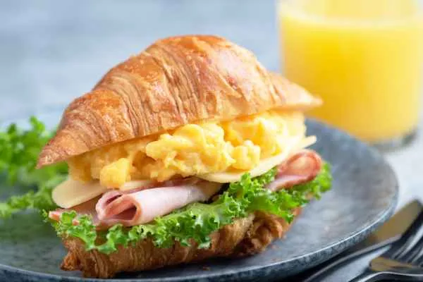 2 Eggs, Cheese and Meat on a Croissant